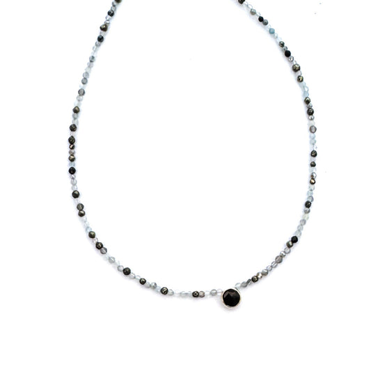 Necklace with black and white beads on a white background