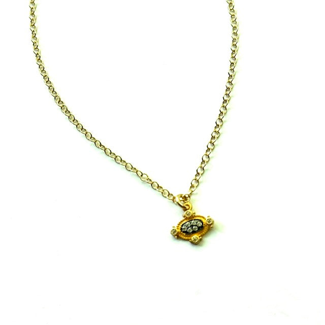 Gold necklace with a small pendant on a white background