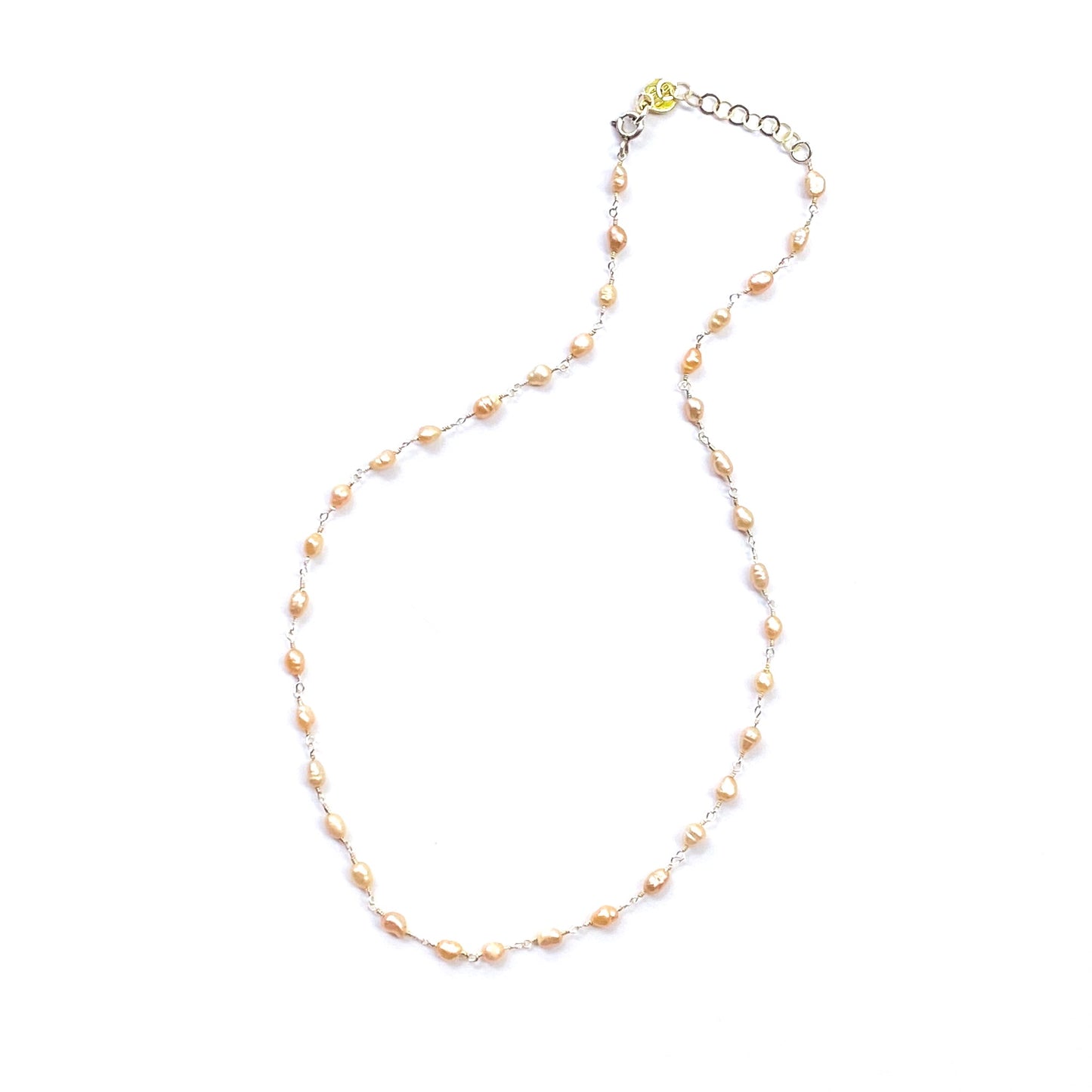 Necklace with small pearls on a white background