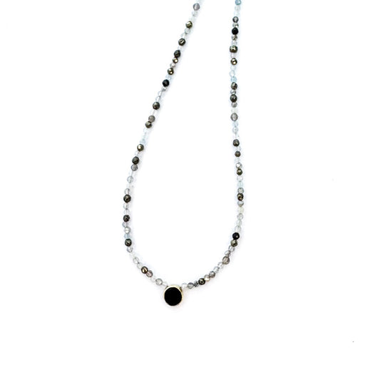 Necklace with small beads on a white background