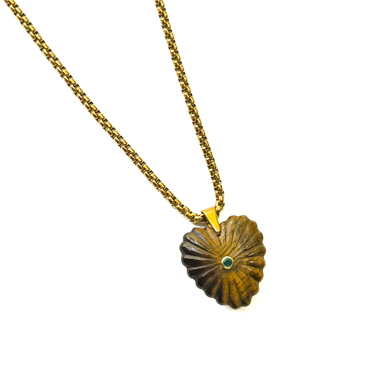 A gold chain necklace featuring a textured, scalloped gold pendant with a small green stone inlay at the center, shown against a plain white background.
