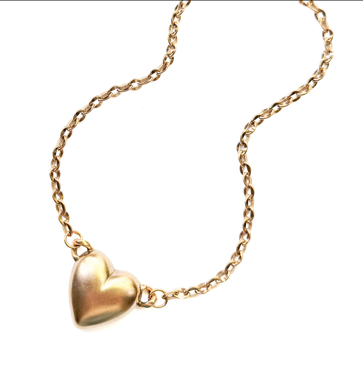 A gold heart pendant necklace on a gold chain, shown on a plain white background.