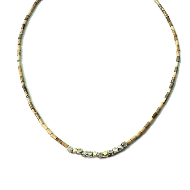 Necklace with small beads on a white background