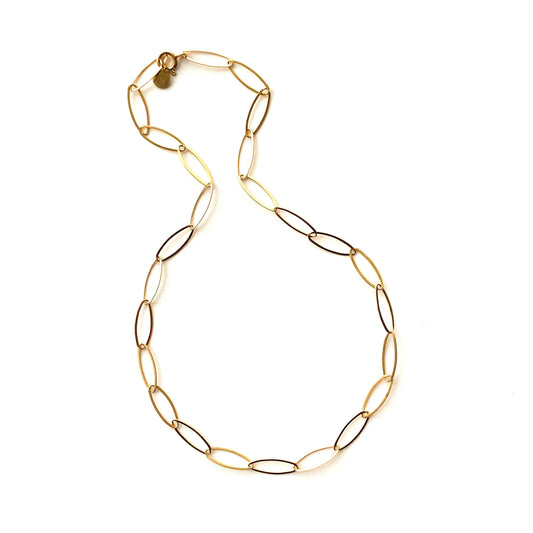 Gold chain necklace on a white background