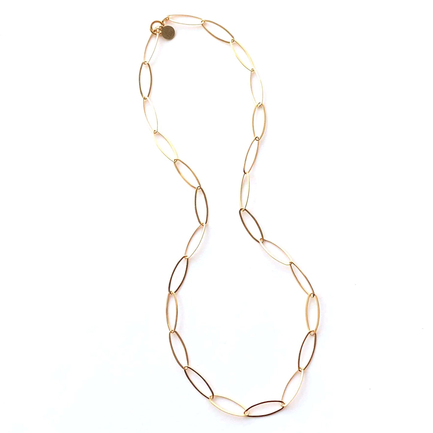 Gold chain necklace on a white background