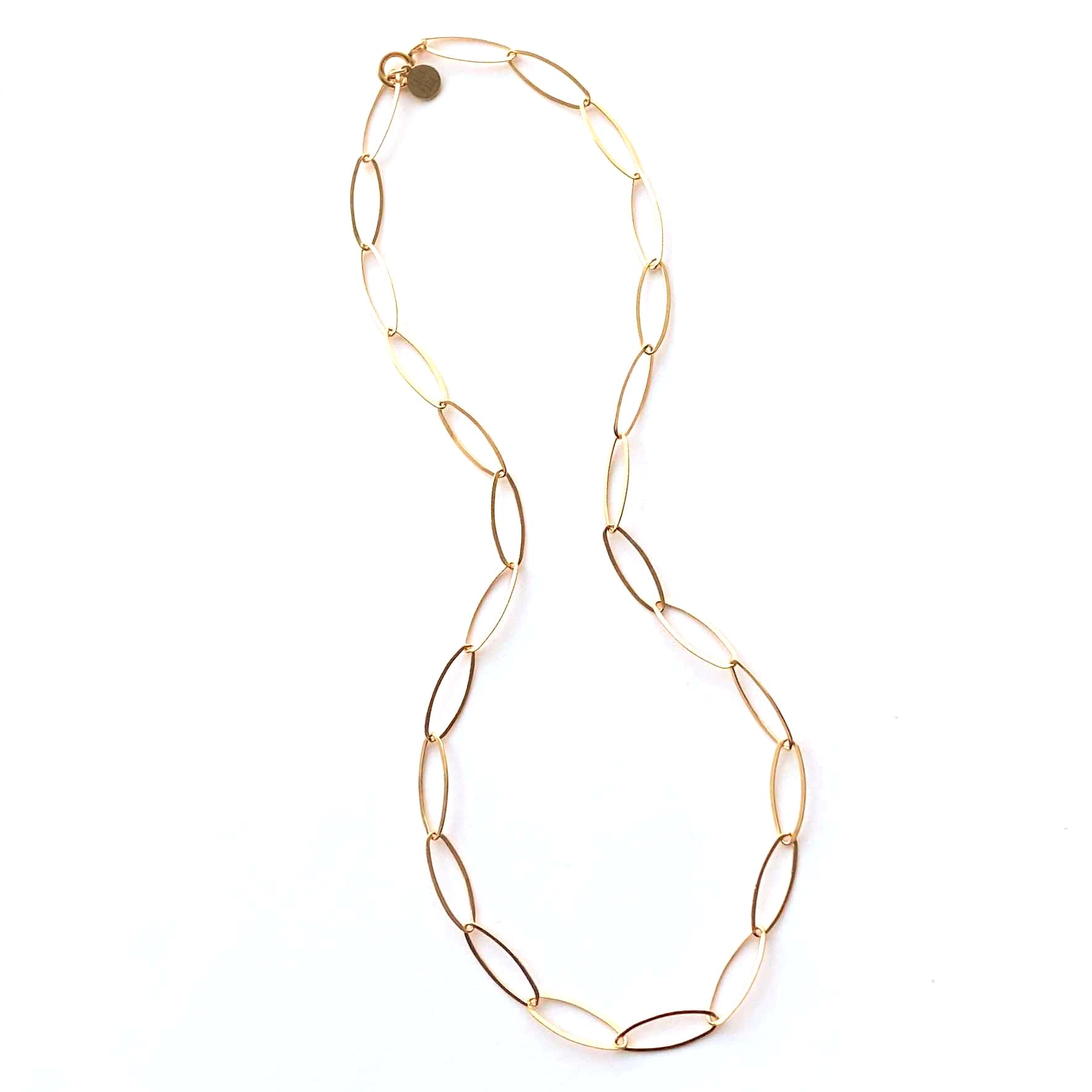 Gold chain necklace on a white background