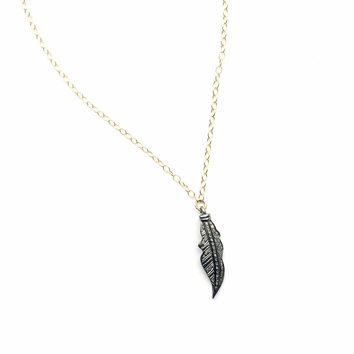 Necklace with a feather pendant on a white background