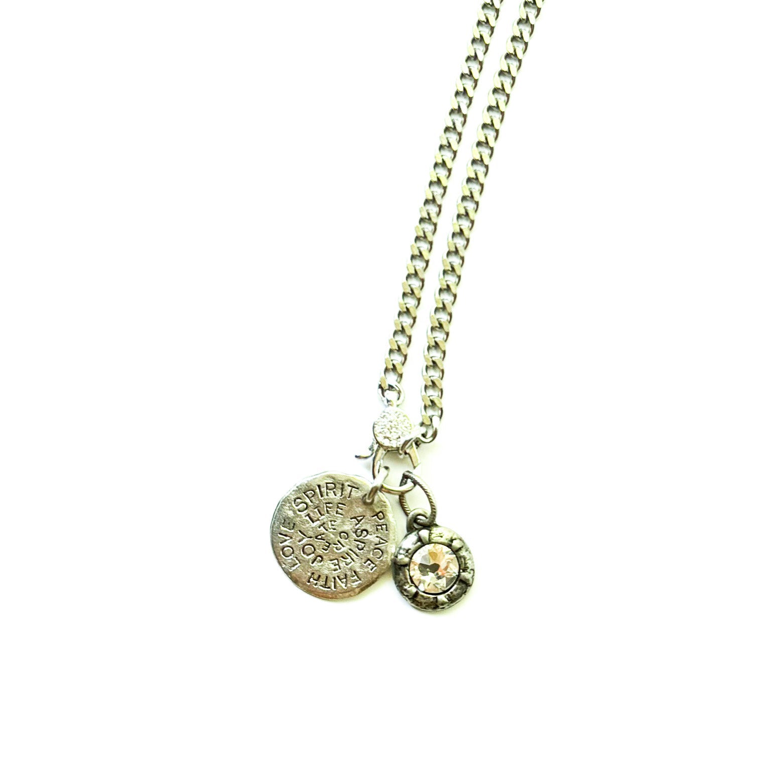 Silver necklace with two pendants on a white background