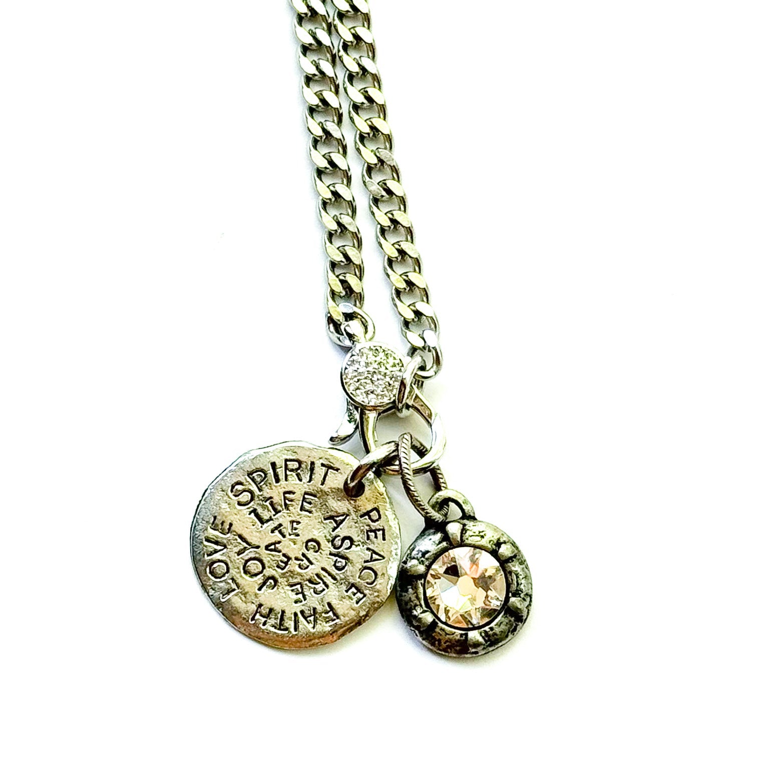Necklace with two round pendants on a white background