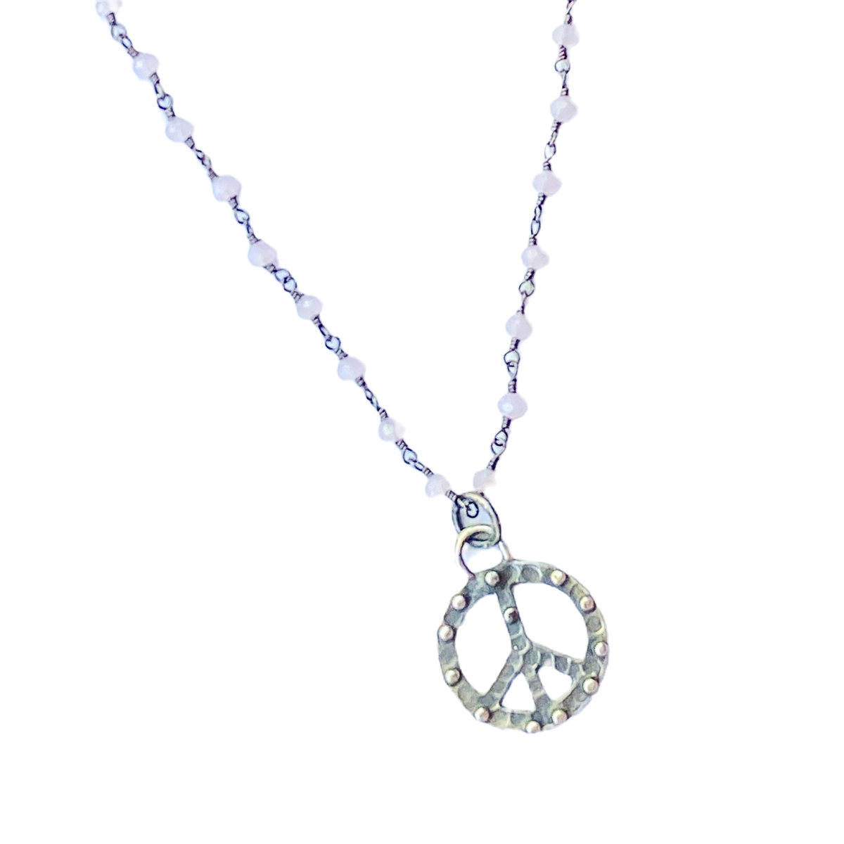 Necklace with peace sign pendant on a white background