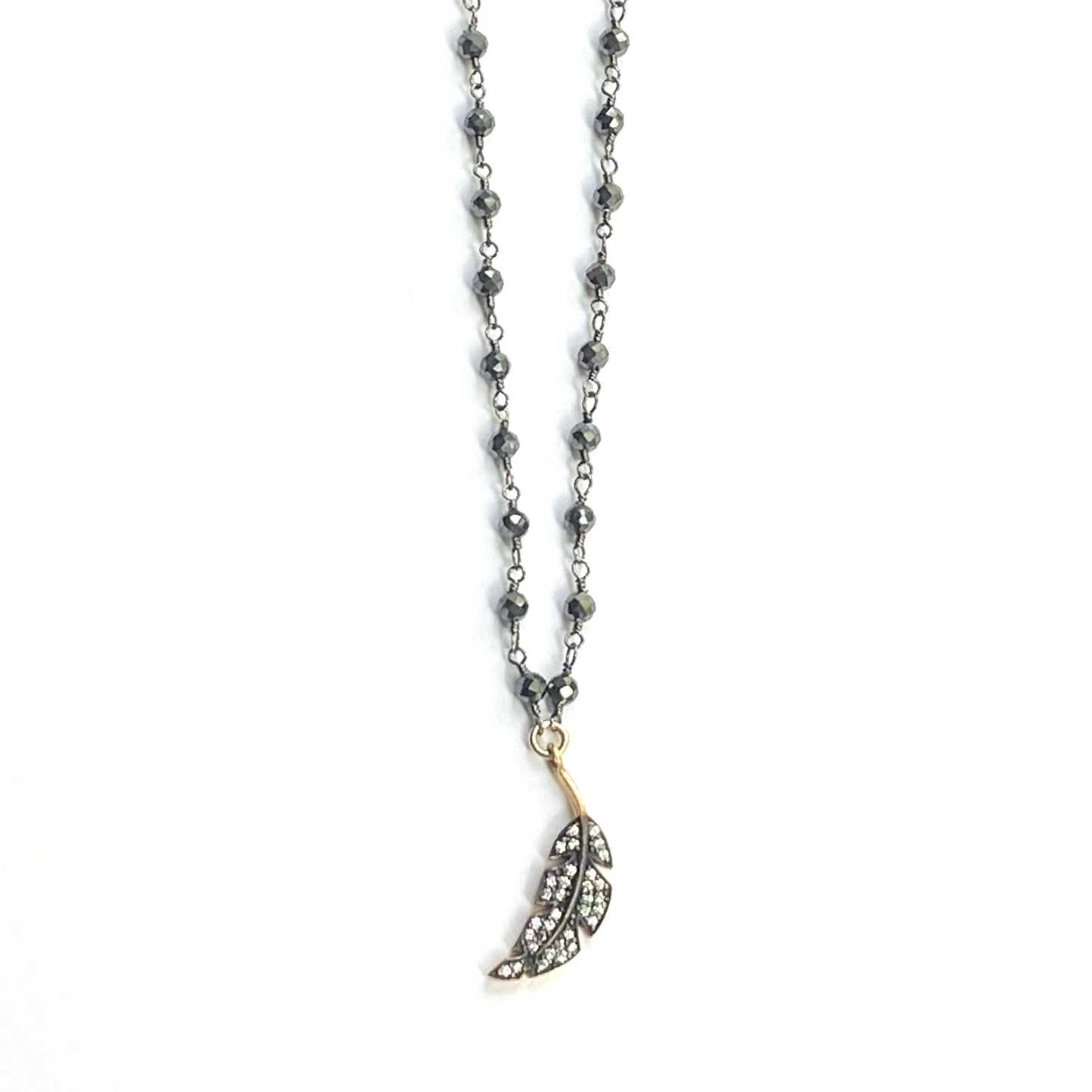 Necklace with a feather pendant on a white background