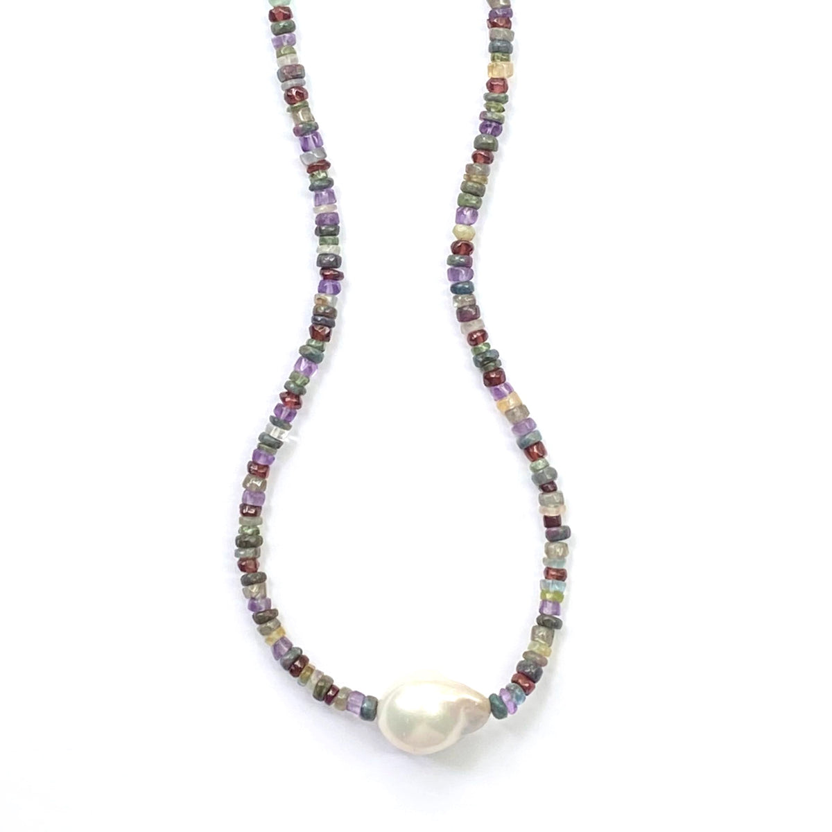Necklace with multicolored beads and a large pearl on a white background