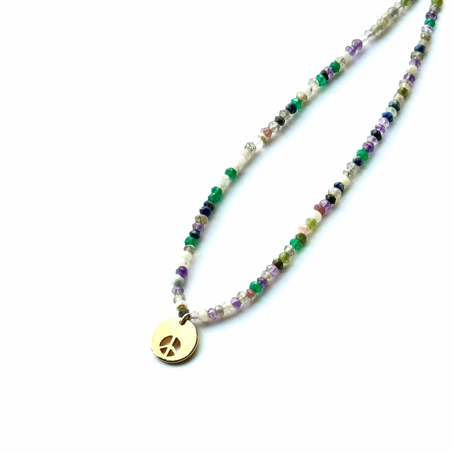 Necklace with peace sign pendant on a white background