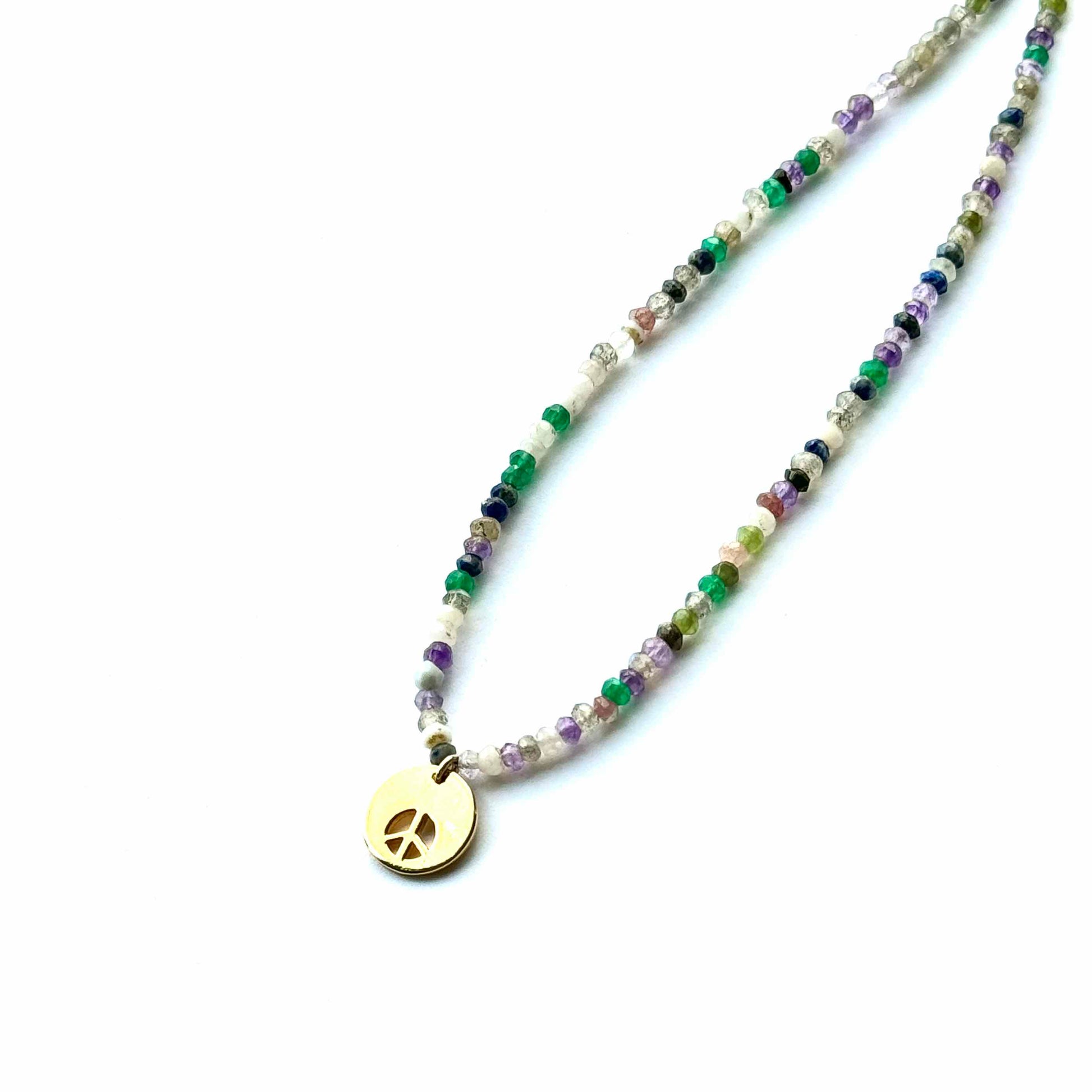Necklace with peace sign pendant on a white background